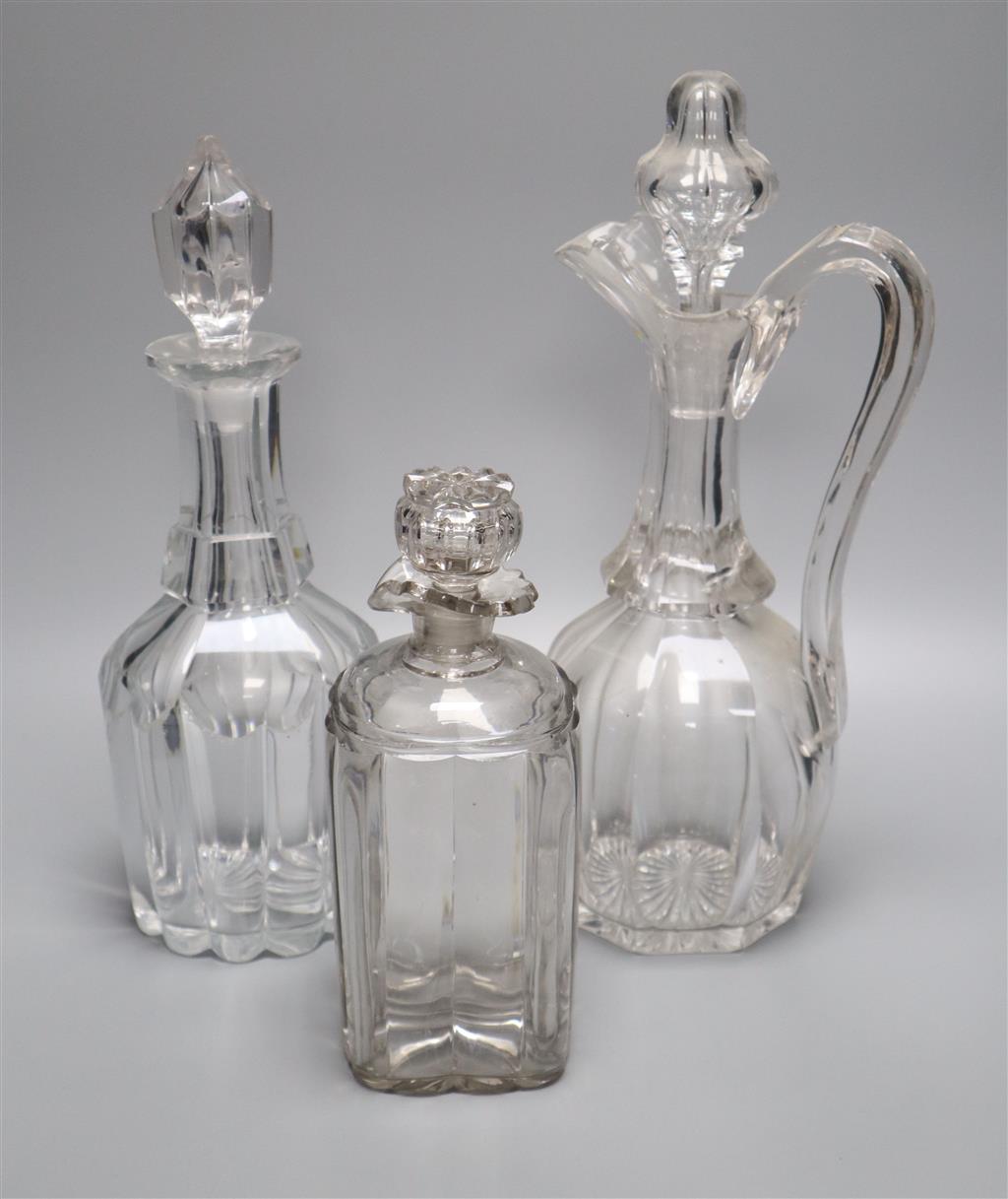 A Victorian cut glass claret jug and two decanters, tallest 34cm